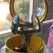 The beacon's twin lamps and mounting inside its yellow housing