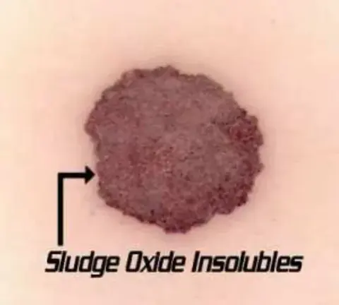 A filter patch showing sludge oxide insolubles