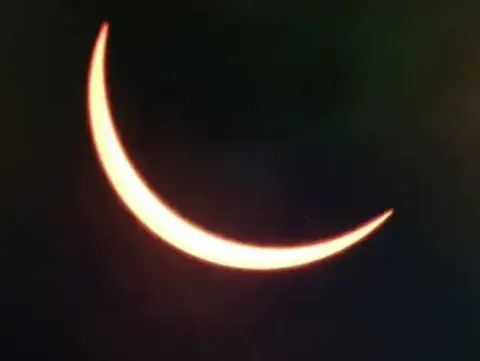 A thin crescent of the sun during the eclipse
