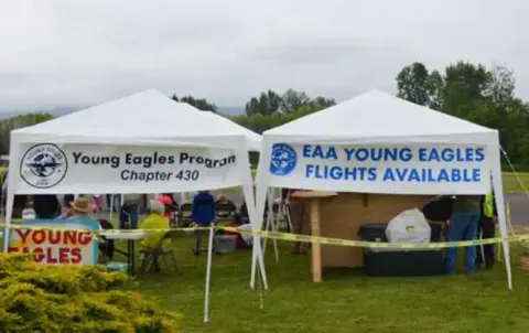 Young Eagles canopy tents set up next to the ramp