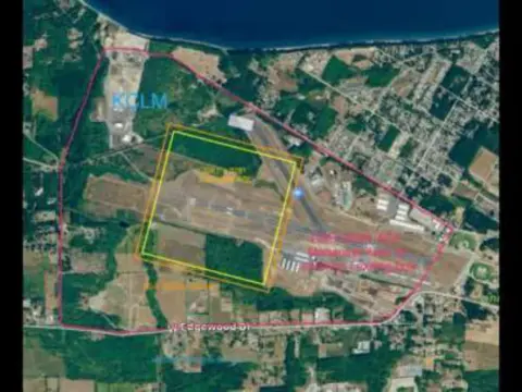 An aerial photo of an airport with a practice area outlined in yellow