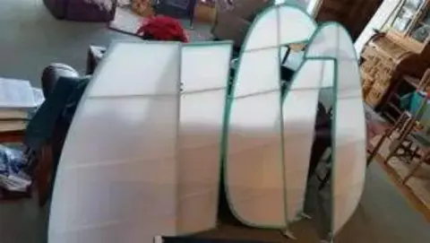 Fabric-covered tail surfaces standing in the shop