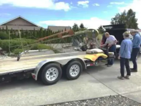 Smith Mini Biplane leaving Donna’s garage and going to a temporary home in Ernie’s hangar