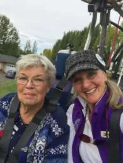 Two smiling women in a balloon basket