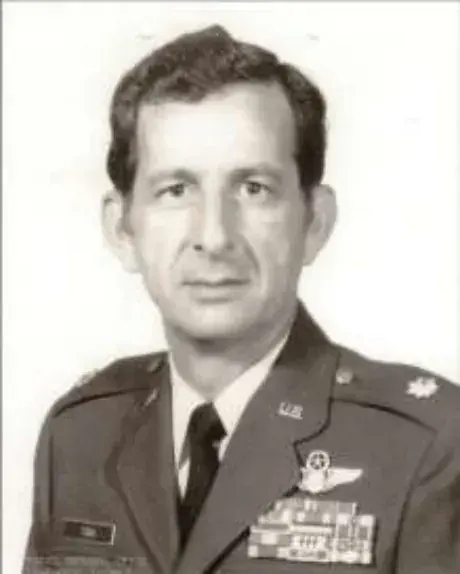 A black and white portrait of a man in a military uniform