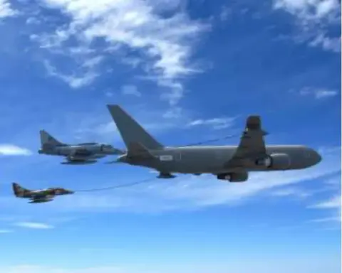 A tanker jet refueling fighters in flight