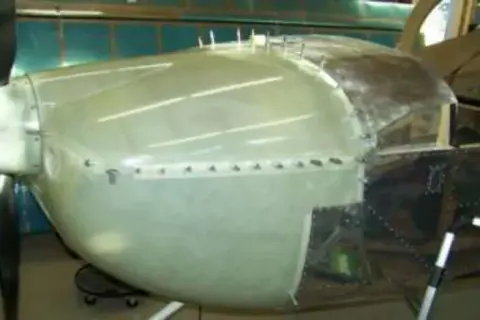 A metal fuselage with a canopy frame under construction