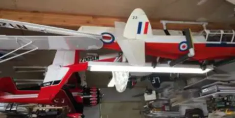 Model airplanes hanging from a ceiling