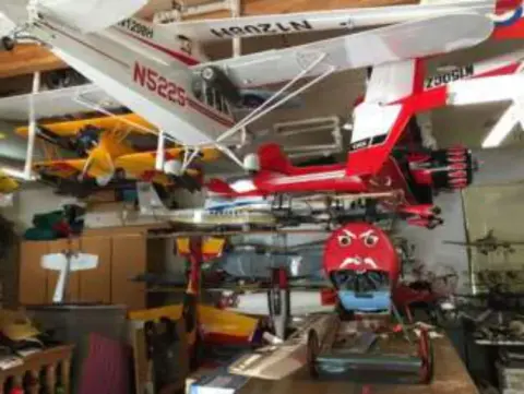 A room crowded with model airplanes
