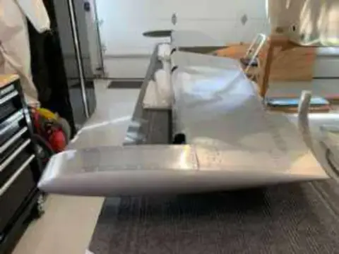A metal tail surface under construction in a workshop