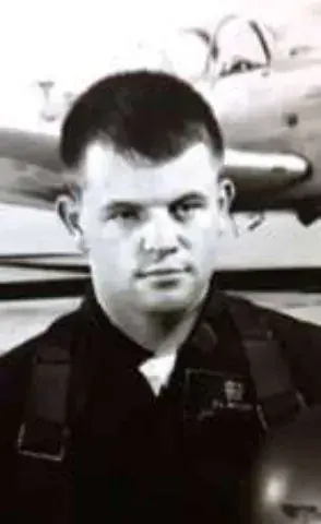 A black and white portrait of a young man