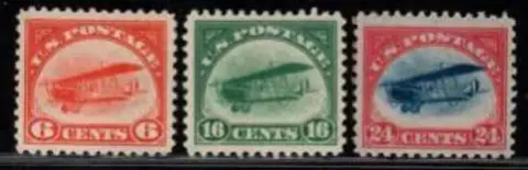 Three vintage airmail stamps showing the Curtiss Jenny