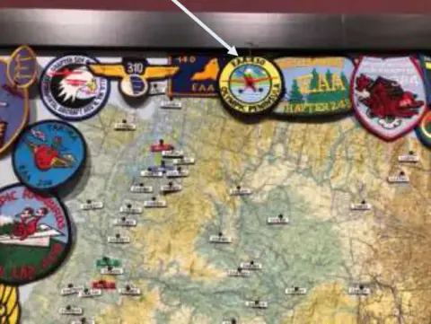 Close-up of a wall map covered with EAA chapter patches