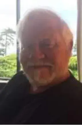 A close-up of a bearded man