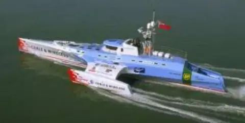 A futuristic powerboat on the water