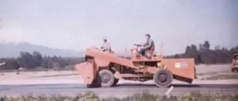 An old photo of a tractor clearing land