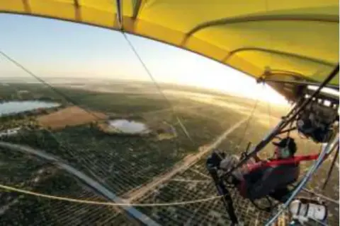 A view from a powered parachute over farmland