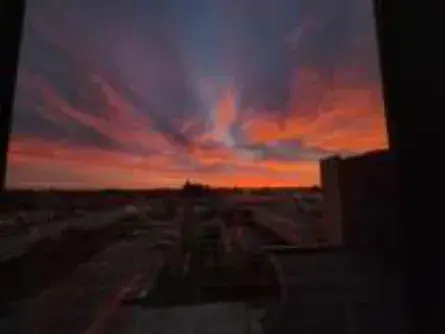 A vivid red and orange sunset sky