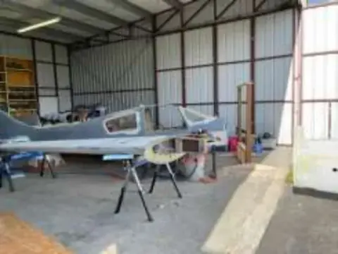 A homebuilt airplane under construction in a hangar