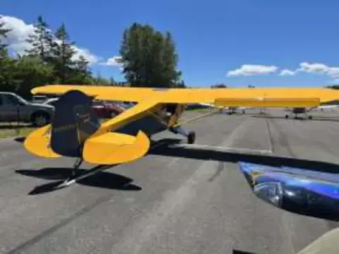 A yellow Cub parked on the ramp