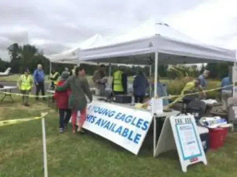 A pop-up tent and an EAA Young Eagles Flights Available banner