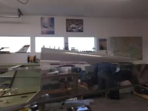 Airplane wings and parts in a workshop