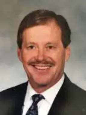 Portrait of a smiling man in a suit and tie