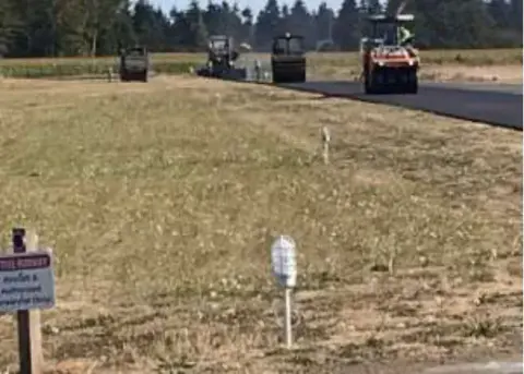 Paving machines working on the runway