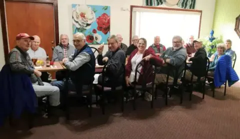 Chapter members seated around a long table at the Las Palomas restaurant in Sequim