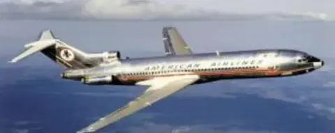 A three-engine jetliner in flight