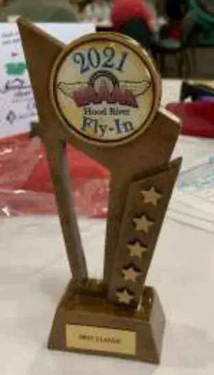 A gold trophy with a 2022 award plaque
