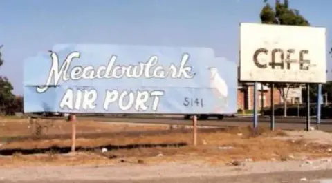 The Woodinville Airport and Cafe signs