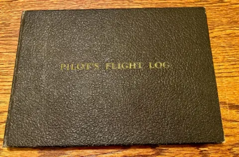 An old pilot logbook and a certificate