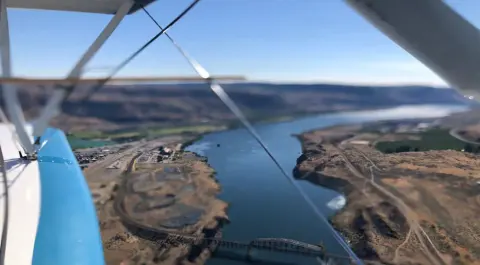 A river canyon seen from under a high wing