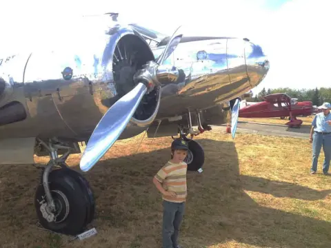 5yo Nathan in front of a Beech C-45