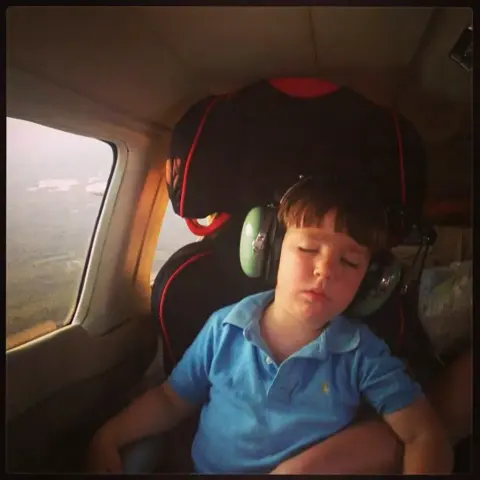 4yo Nathan asleep in the back of Uncle Steve’s Piper Lance