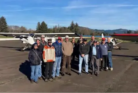 Fly-out members standing in a row on the ramp