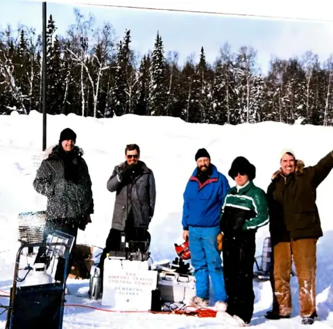 Ray is in there somewhere.... Sign reads: FAA Airport Traffic Control Tower - Skwentna, Alaska