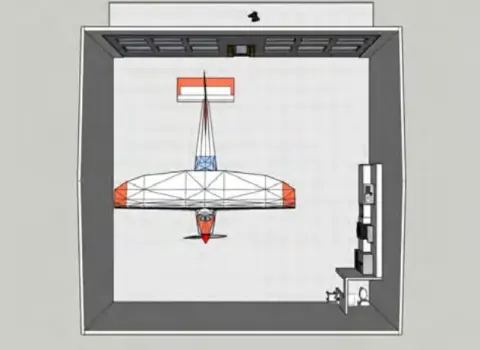 Top-down plan drawing of the proposed hangar with an airplane inside