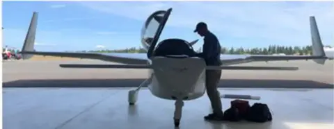 Mark Rieger preflights his Cozy Mk I during recent visit to Port Angeles