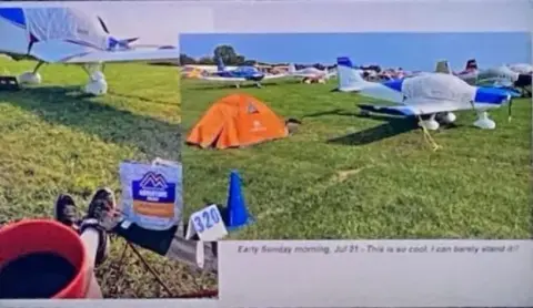 Tent camping beside parked airplanes on the grass at Oshkosh