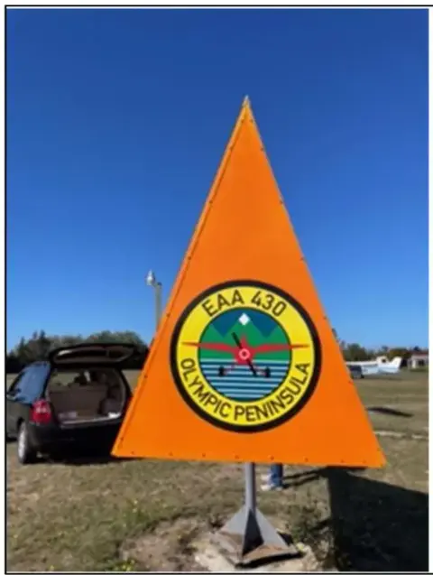 Orange tetrahedron wind indicator with the chapter logo