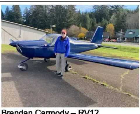 Pilot standing beside a blue and white RV-12, captioned Brendan Carmody RV12