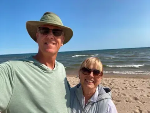 Couple taking a selfie on a beach