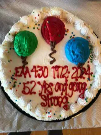 Decorated cake with colored frosting circles and writing