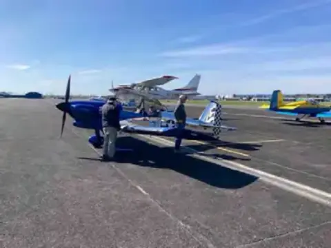 Low-wing airplane parked on the ramp at Arlington