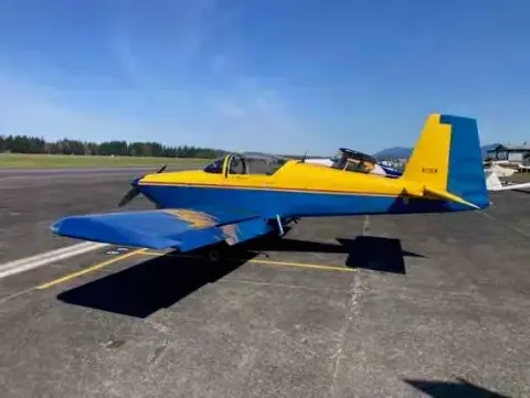 Yellow and blue RV-type airplane on the ramp