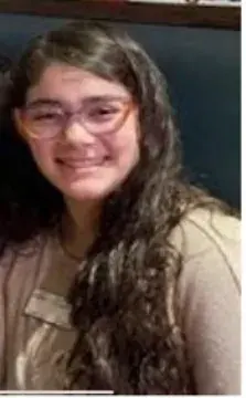 Portrait of a smiling young woman with glasses