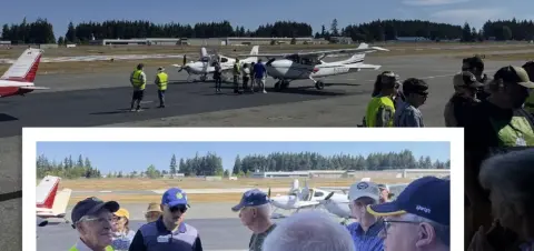 Young Eagles and volunteers on the ramp beside parked airplanes