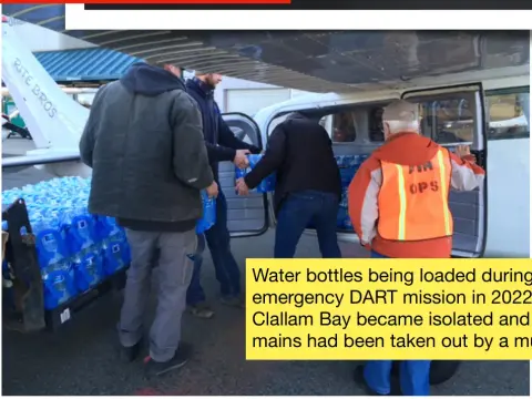 Water bottles being loaded during an actual emergency DART mission in 2022 after Clallam Bay became isolated and their water mains had been taken out by a mud slide